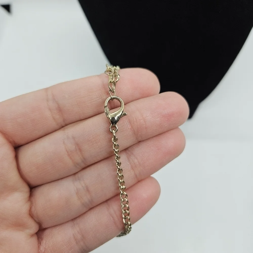 gold tone articulated crescent bib necklace